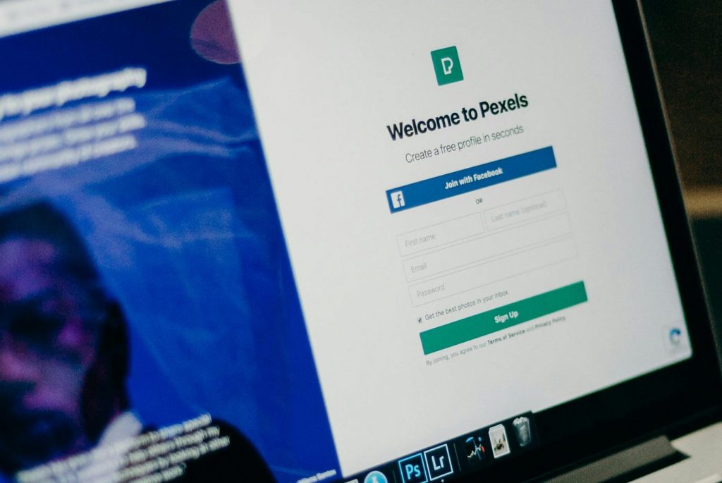 Close-up view of a laptop displaying a sign-up page for an online platform.